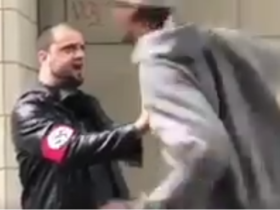 A man wearing a swastika armband was caught on video being punched in downtown Seattle: Twitter/Peter Baggenstos