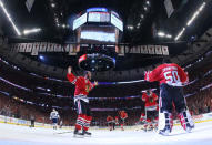 Jun 15, 2015; Chicago, IL, USA; Chicago Blackhawks goalie Corey Crawford (50) celebrates with center Jonathan Toews (19) after defeating the Tampa Bay Lightning in game six of the 2015 Stanley Cup Final at United Center. Mandatory Credit: Bruce Bennett/Pool Photo via USA TODAY Sports