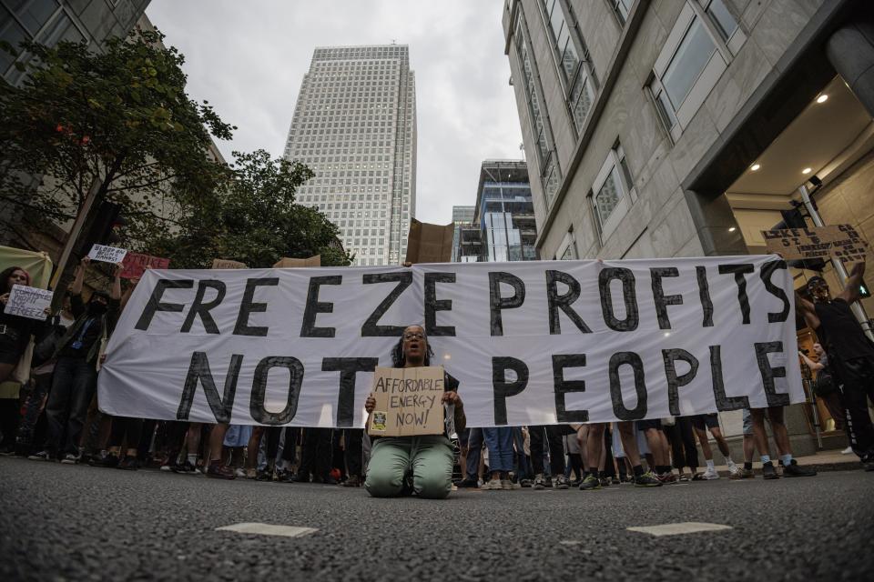 Protesters calling for affordable energy block the road outside Ofgem’s headquarters in Canary Wharf on 26 August 2022 in London, England (Getty Images)