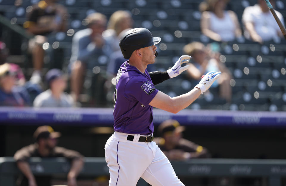 Colorado Rockies' Trevor Story tosses his bat after hitting a two-run home run off San Diego Padres relief pitcher Nabil Crismatt in the fifth inning of a baseball game Wednesday, Aug. 18, 2021, in Denver. (AP Photo/David Zalubowski)