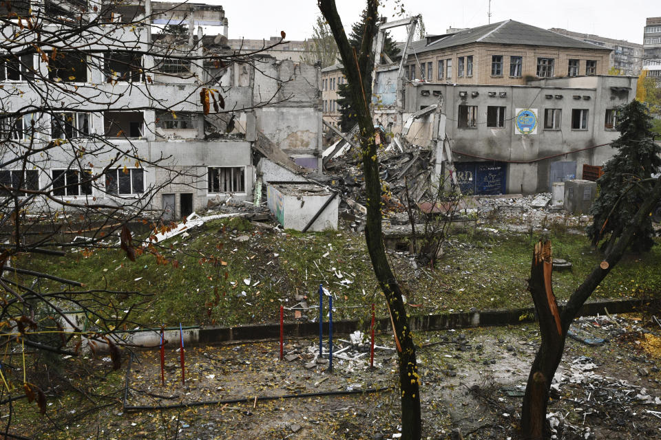 A view of buildings damaged by Russian shelling in Druzhkivka, Donetsk region, Ukraine, Wednesday, Oct. 26, 2022. (AP Photo/Andriy Andriyenko)