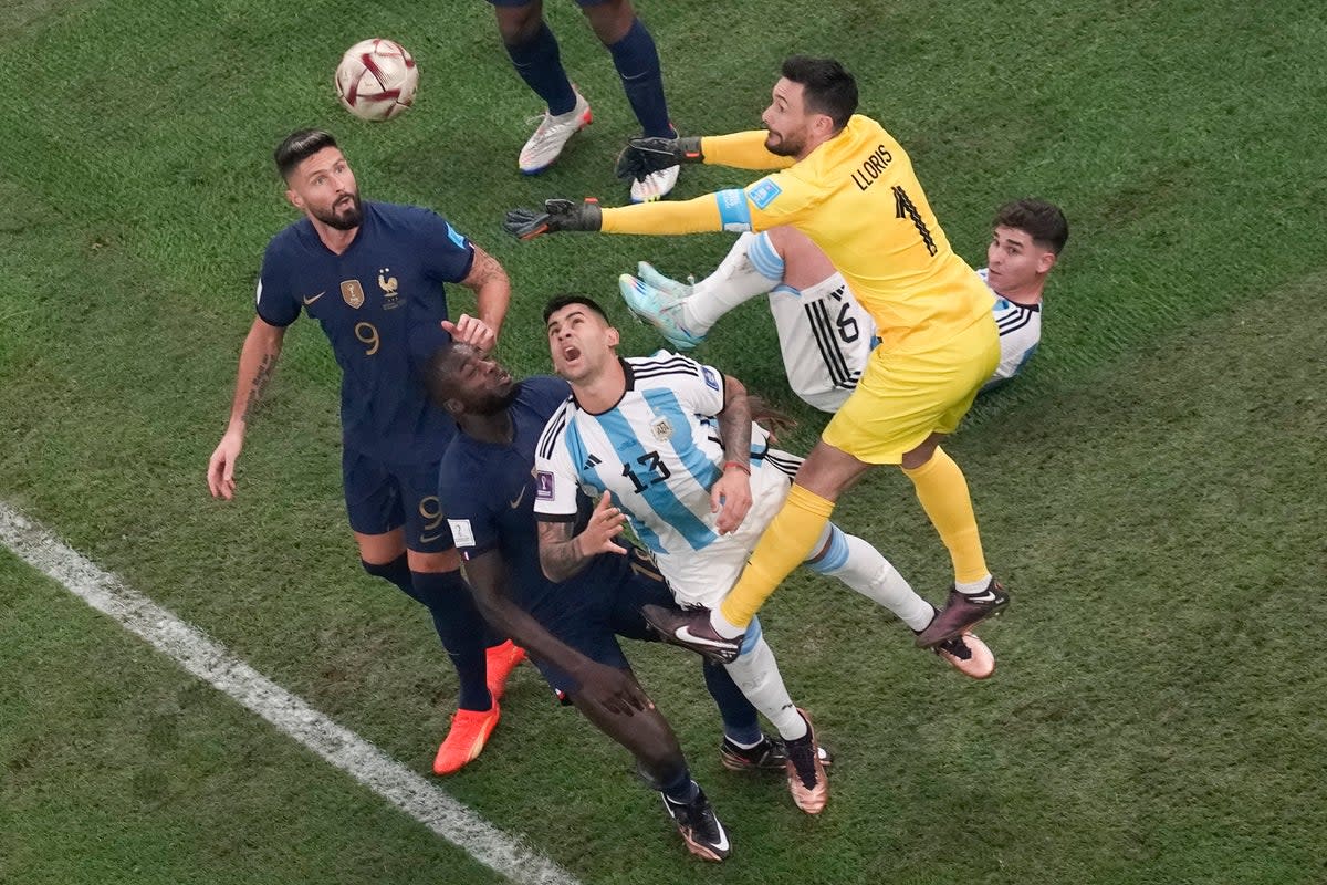 Tottenham’s Hugo Lloris (top right) and Cristian Romero (centre) reached the World Cup final along with Julian Alvarez (on ground)(Thanassis Stavrakis/AP) (AP)