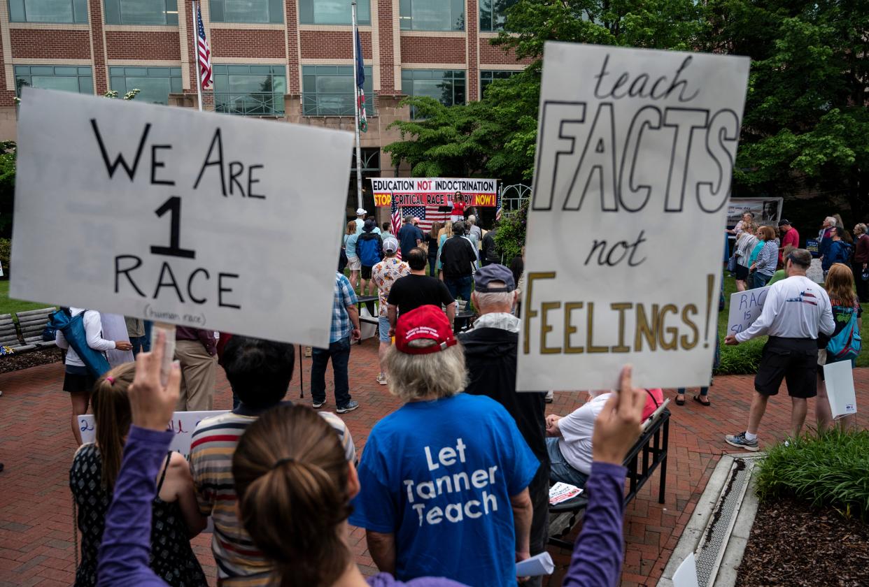 Protesters gather in Virginia on June 12, 2021, to protest critical race theory. Congressman Mark Green has called for an Air Force Academy professor to be fired for teaching CRT to students (AFP via Getty Images)