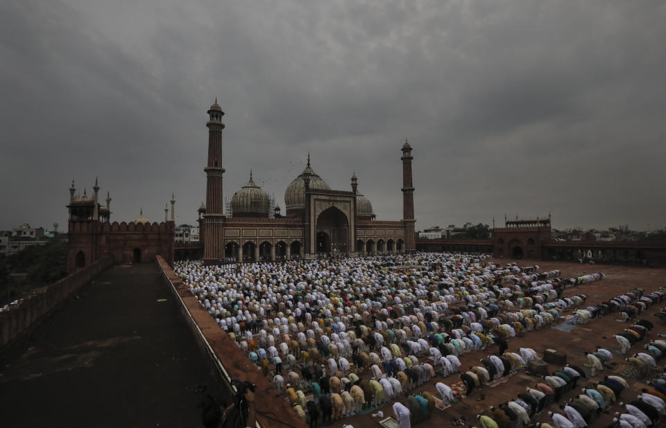 Indian Muslims offer Eid al-Adha prayers at the Jama Masjid in New Delhi, India, Saturday, Aug. 1, 2020. Eid al-Adha, or the Feast of the Sacrifice, is observed by sacrificing animals to commemorate the prophet Ibrahim's faith in being willing to sacrifice his son. (AP Photo/Manish Swarup)