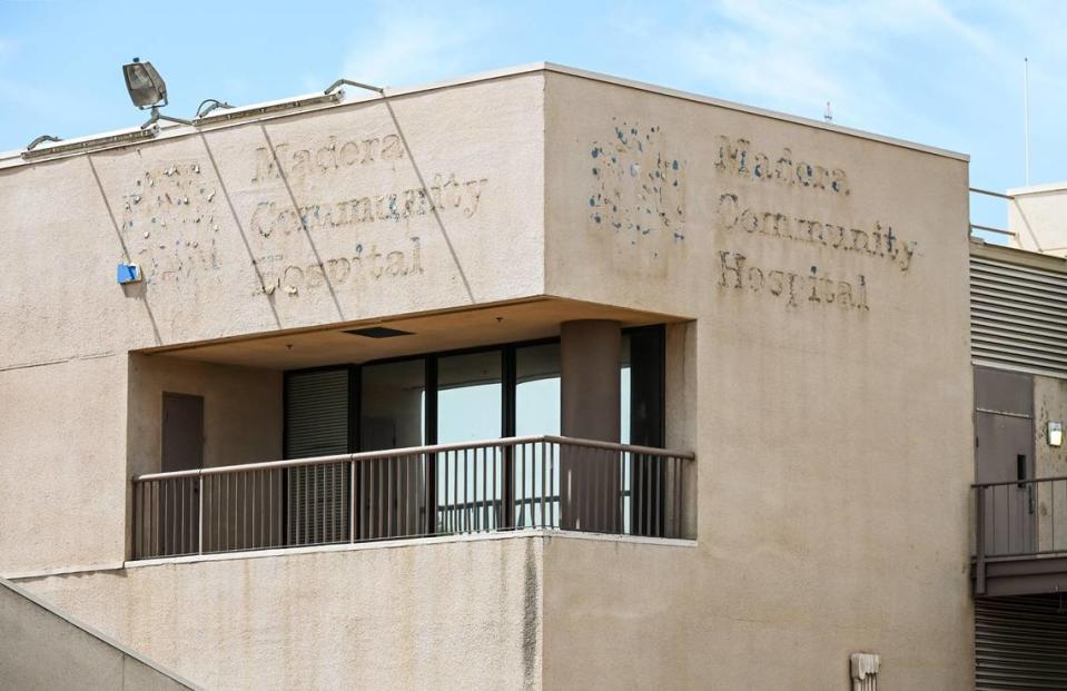 Faded signs are visible on the wall outside Madera Community Hospital on Monday, July 24, 2023. The hospital closed early this year.