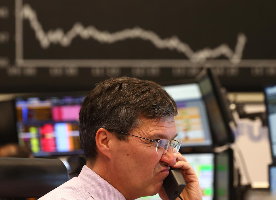 A stock trader looks at his screens during a trading session at Frankfurt's stock exchange as markets react on the coronavirus disease (COVID-19) at the stock exchange in Frankfurt, Germany, March 16, 2020.   REUTERS/Kai Pfaffenbach