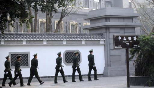 Chinese paramilitary police patrol the grounds of the Communist Party provincial headoffice in Chongqing on March 15, 2012, the former office of Bo Xilai. Bo's wife is being investigated over the murder of British businessman Neil Heywood