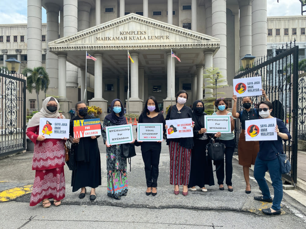 Members of Family Frontiers hold up placards demanding equal citizenship rights for Malaysians outside the Kuala Lumpur High Court September 13, 2021. — Picture courtesy of Family Frontiers