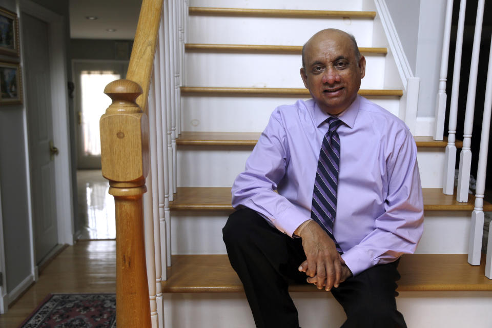 CORRECTS LAST NAME TO SHELAT, NOT SHEBAT, IN SECOND REFERENCE - Kiran Shelat, a 65-year-old retired civil engineer, poses for a portrait in his home, Monday Aug. 6, 2018, in Yardley, Pa. Shelat had spent two years on a kidney transplant waiting list before signing up for a bold experiment with 19 others in which they received organs infected with hepatitis C. A study finds U.S. patients who accepted kidneys infected with hepatitis C were later cured. Results were published Monday in the journal Annals of Internal Medicine. (AP Photo/Jacqueline Larma)