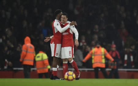 Football Soccer Britain - Arsenal v Stoke City - Premier League - Emirates Stadium - 10/12/16 Arsenal's Mesut Ozil and Alex Iwobi celebrate after the game Reuters / Clodagh Kilcoyne Livepic