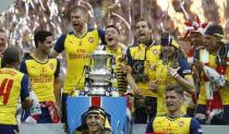 Arsenal celebrate with the trophy after winning the FA Cup Final. Action Images via Reuters / Carl Recine