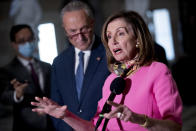 House Speaker Nancy Pelosi of Calif., center, accompanied by Senate Minority Leader Sen. Chuck Schumer of N.Y., left, speak to reporters following a meeting with Treasury Secretary Steven Mnuchin and White House Chief of Staff Mark Meadows as they continue to negotiate a coronavirus relief package on Capitol Hill in Washington, Friday, Aug. 7, 2020. (AP Photo/Andrew Harnik)