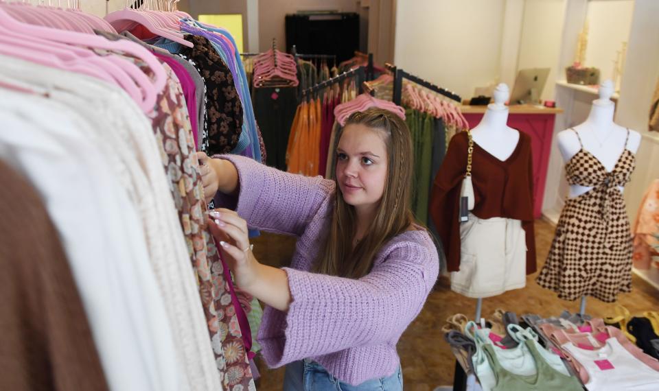 Kayla Cameron, owner of Kaylee boutique on Main Street, works at the store Thursday, Sept. 22, 2022, in Ames, Iowa.