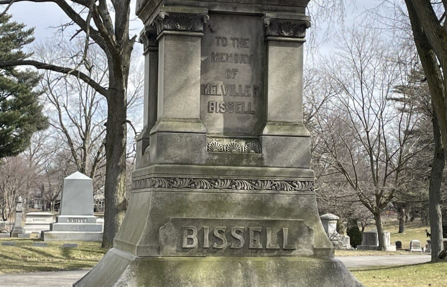 A giant stone memorial with "Bissell" etched in large letters. In a smaller set, it reads "To the memory of Melville R. Bissell."