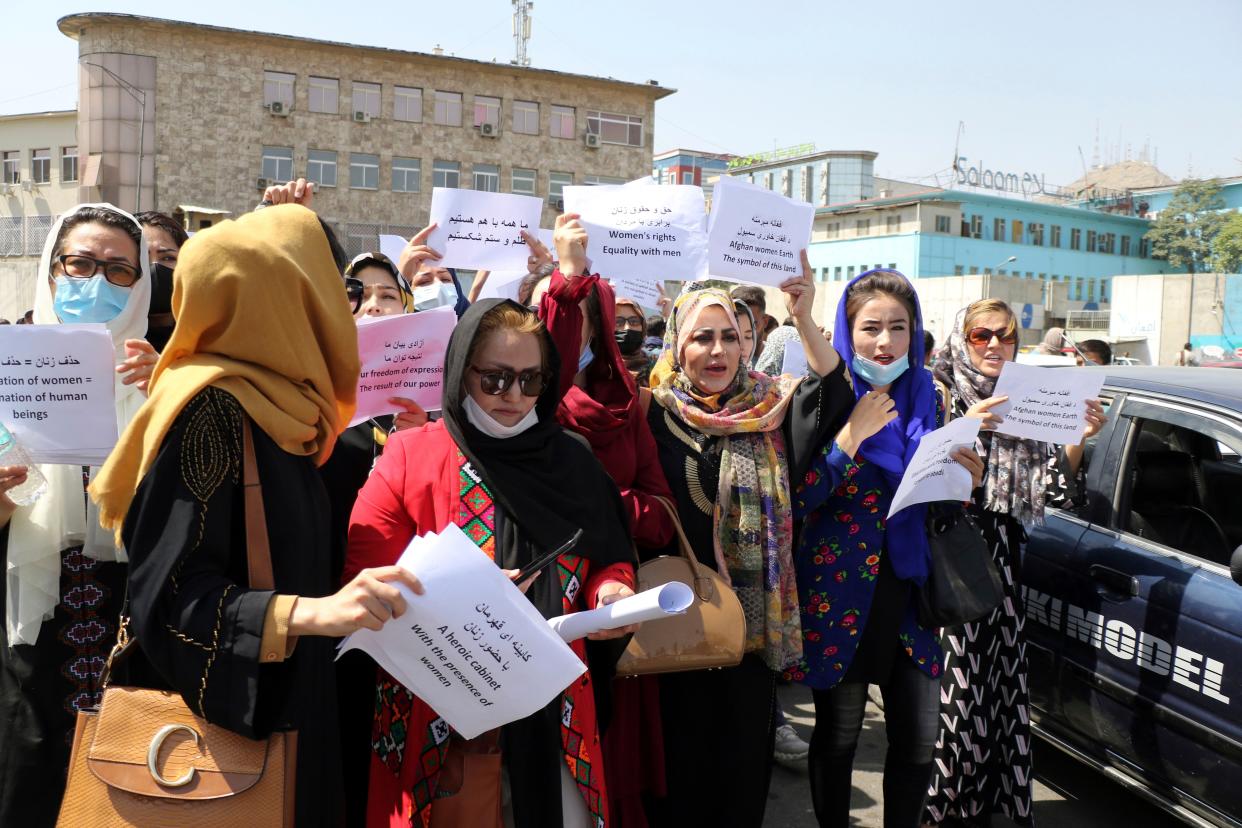 Women gather to demand their rights under the Taliban rule during a protest in Kabul, Afghanistan, Friday, Sept. 3. 