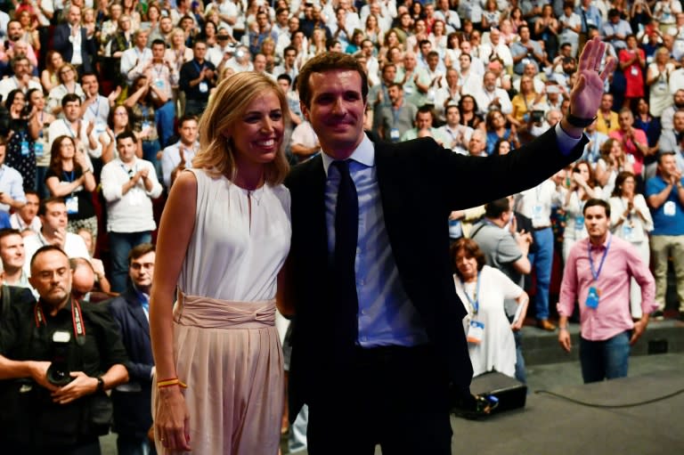 Casado, pictured here with his wife, has promised "hope" with a generational revamp of the party and a step further to the political right