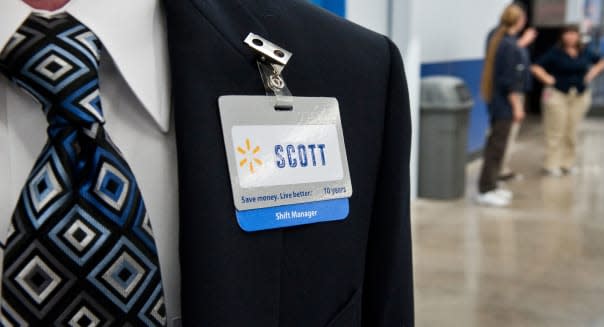 Anglo male shift manager at Walmart is ready to greet customers at grand opening of new store in Austin, Texas, USA.