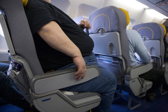 obese person travelling by plane