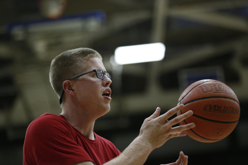 17 AUG 2016: Josh Speidel shoot hoops with his friends Gabe Holt, St. Francis Brooklyn basketball player (in GREY Shirt), Christian Glass, Xavier baseball player (whit shirt, black shorts) and Elliott Welmer, St. Louis basketball player (Blue shorts) in his high school gym in Columbus, Ind..  AJ Mast/ NCAA Photos via Getty Images