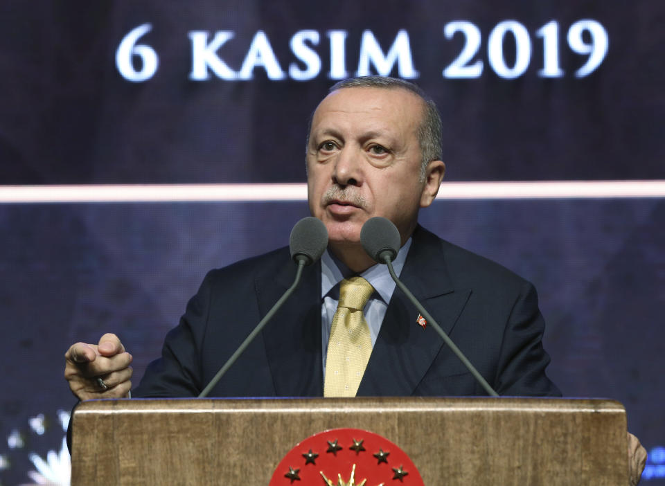 Turkish President Recep Tayyip Erdogan speaks during a meeting in Ankara, Turkey, Wednesday, Nov. 6, 2019. Erdogan says Turkey has captured a wife of the slain leader of the Islamic State group, Abu Bakr al-Baghdadi. Erdogan made the announcement while delivering a speech in Ankara on Wednesday but gave no other details. (Presidential Press Service via AP, Pool)