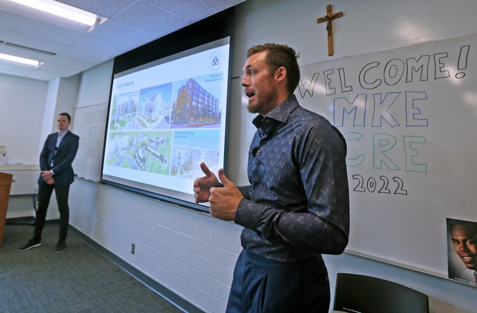 Bucks player Pat Connaughton answers questions about real estate while participating in a program at Marquette University in 2022.