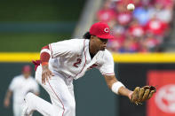 Cincinnati Reds shortstop Jose Barrero (2) attempts to field a single hit by Chicago Cubs' Nick Madrigal during the fifth inning of a baseball game Saturday, Aug. 13, 2022, in Cincinnati. (AP Photo/Jeff Dean)