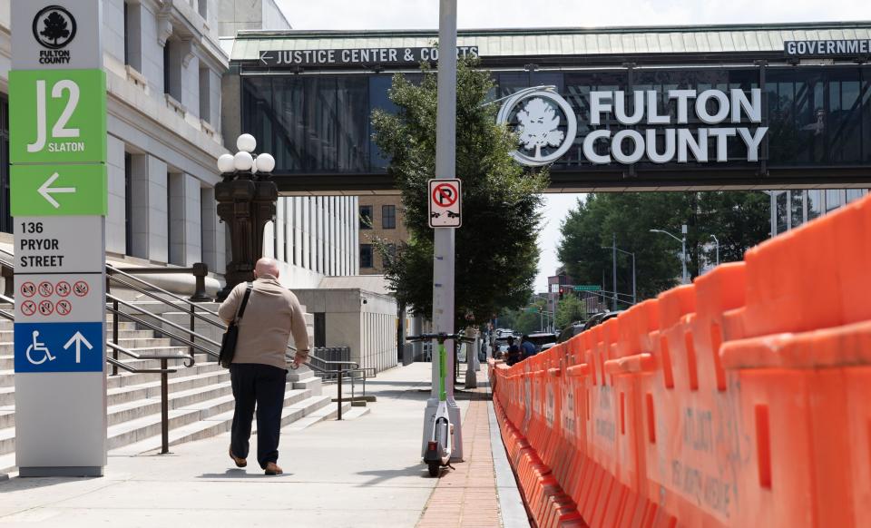 Orange barricades in front of Fulton County Courthouse in Atlanta.