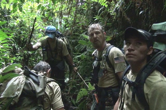<p>Warner Bros. Discovery</p> Mickey Grosman and the crew hiking in "Expedition from Hell: The Lost Tapes."