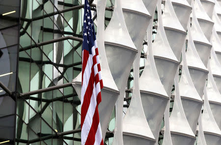 FILE PHOTO: The US flag flies outside the new U.S. Embassy in Nine Elms in London, Britain January 12, 2018. REUTERS/Peter Nicholls