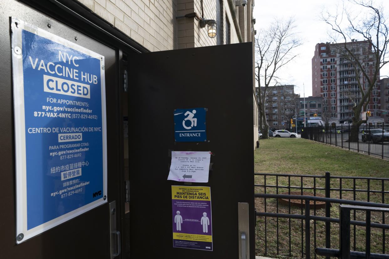 A vaccination center at the Abraham Lincoln High School is closed, Thursday, Jan. 21, 2021 in New York. Officials say about 15 New York City-run COVID-19 vaccination hubs are postponing all first-dose appointments and other sites have stopped making new appointments as the city waits for more vaccine supplies. (AP Photo/Mark Lennihan)