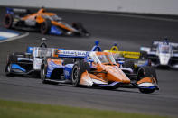 Scott Dixon, of New Zealand, drives through a turn during an IndyCar auto race at Indianapolis Motor Speedway in Indianapolis, Saturday, Oct. 3, 2020. (AP Photo/Michael Conroy)