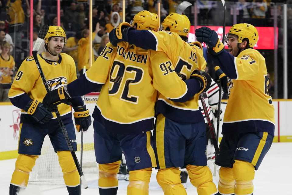 Nashville Predators' Roman Josi (59) is congratulated after scoring a goal against the Chicago Blackhawks in the second period of an NHL hockey game Saturday, April 16, 2022, in Nashville, Tenn. (AP Photo/Mark Humphrey)