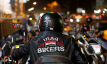 A member of the Iraq Bikers, the first Iraqi biker group, rides his motorbike on the streets of Baghdad, Iraq December 28, 2018. REUTERS/Thaier Al-Sudani