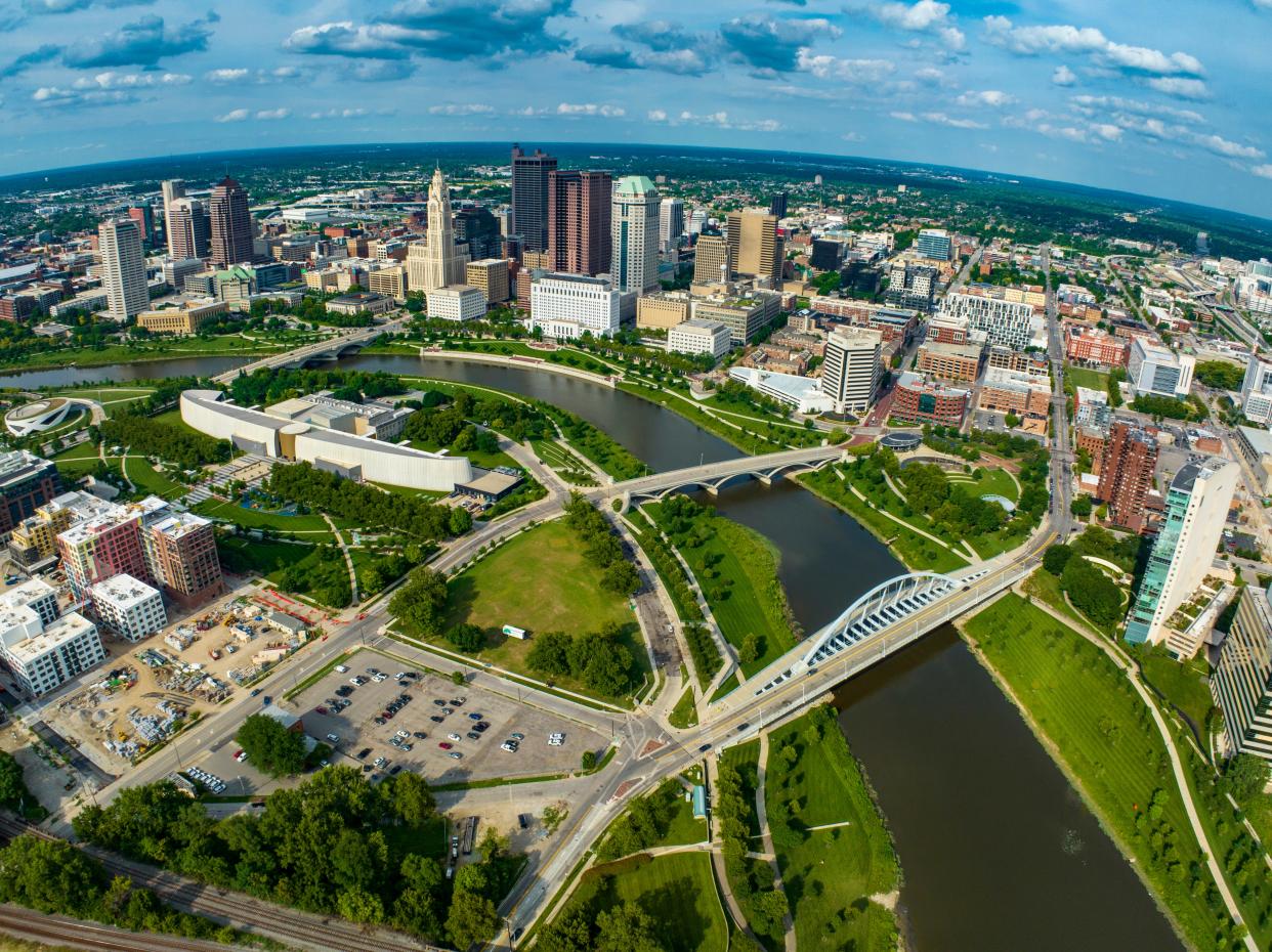 Skyline view of bridges crossing Scioto River that runs through Columbus, Ohio.