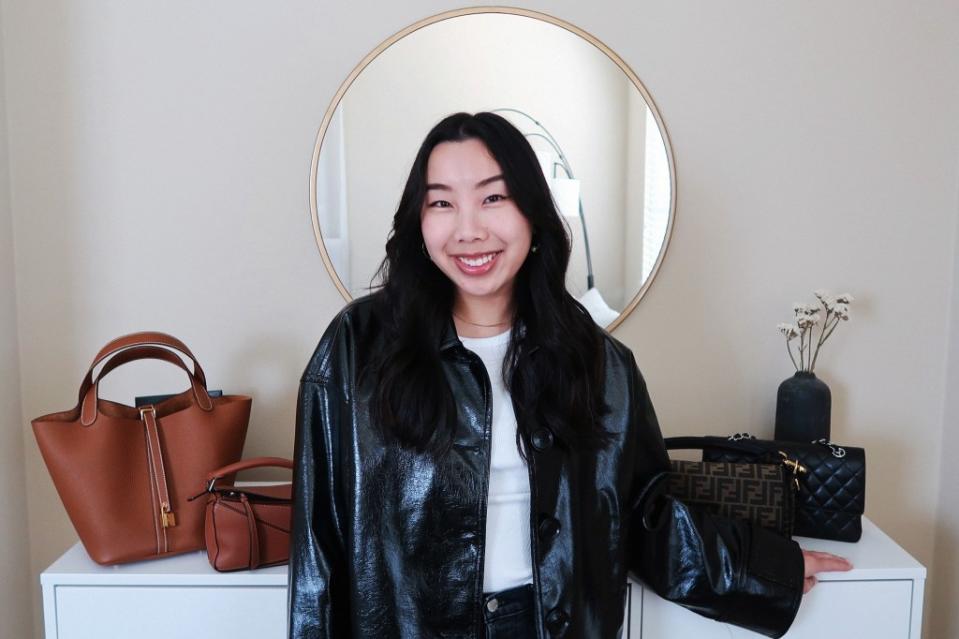 Emily Dao in front of her handbags. Courtesy of Emily Dao