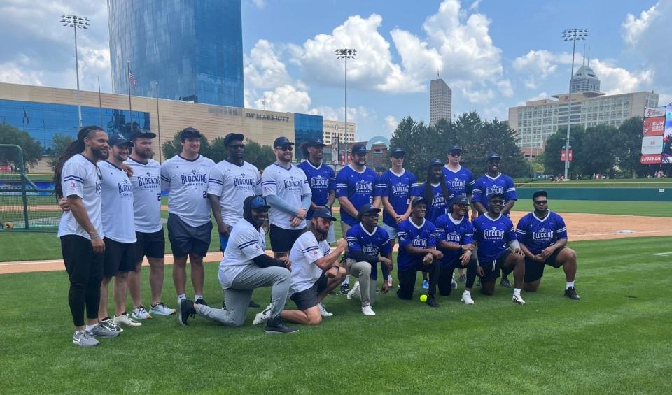 All-Pro guard Quenton Nelson poses with his Colts teammates who came out to participate in his Blocking Cancer celebrity softball game at Victory Field on July 22, 2023.