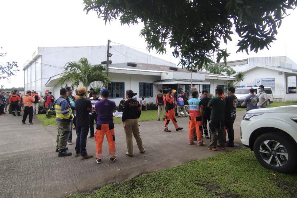 In this handout photo provided by the Civil Aviation Authority of the Philippines, rescuers prepare their search for passengers of a Cessna 340 aircraft with registry number RP-C2080 at Camalig town, Albay province, southeast of Manila, Philippines on Tuesday Feb. 21, 2023. The wreckage of a small plane carrying two Filipino pilots and two Australian passengers was identified Tuesday on one of the Philippines' most active volcanoes, officials said. (Civil Aviation Authority of the Philippines via AP)