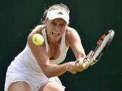 Caroline Wozniacki of Denmark hits a shot during her match against Denisa Allertova of the Czech Republic at the Wimbledon Tennis Championships in London, July 2, 2015. REUTERS/Toby Melville