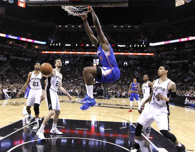 DeAndre Jordan of the Los Angeles Clippers slam dunks against the San Antonio Spurs during Game Four of the Western Conference quarter-finals of the NBA playoffs, in San Antonio, on April 26, 2015