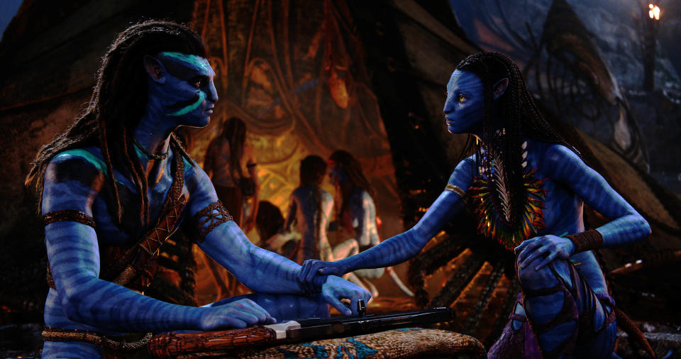 This image released by 20th Century Studios shows, Jake Sully, performed by Sam Worthington, left, and Neytiri, performed by Zoe Saldana in a scene from "Avatar: The Way of Water." (20th Century Studios via AP)