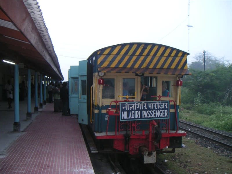 On a cold morning, a crowd of people rush to board the 662SR Mettupalayam-Udhagamandalam (Nilagiri) Passenger.<br><b><br>PAWAN KOPPA</b> is an IT professional who is a full-time techie on weekdays while transforming into a railway fanatic on weekends. Most of his time has been spent in railway photography/ videography ever since he was associated with the IRFCA in May 2005.