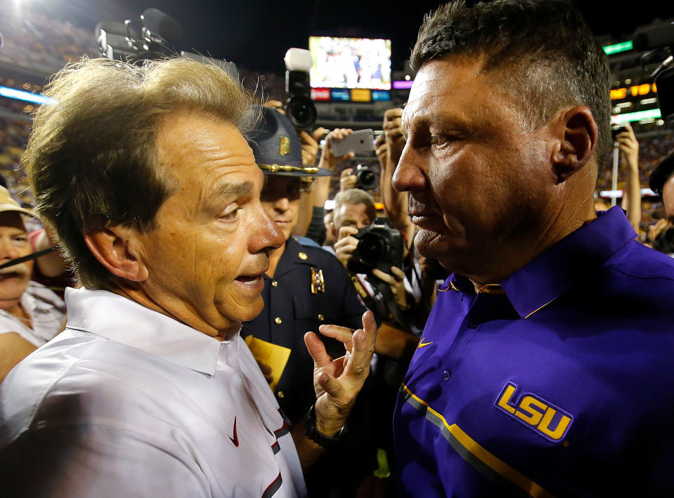 Alabama's Nick Saban and LSU's Ed Orgeron converse after a college football game between their schools. (Getty)