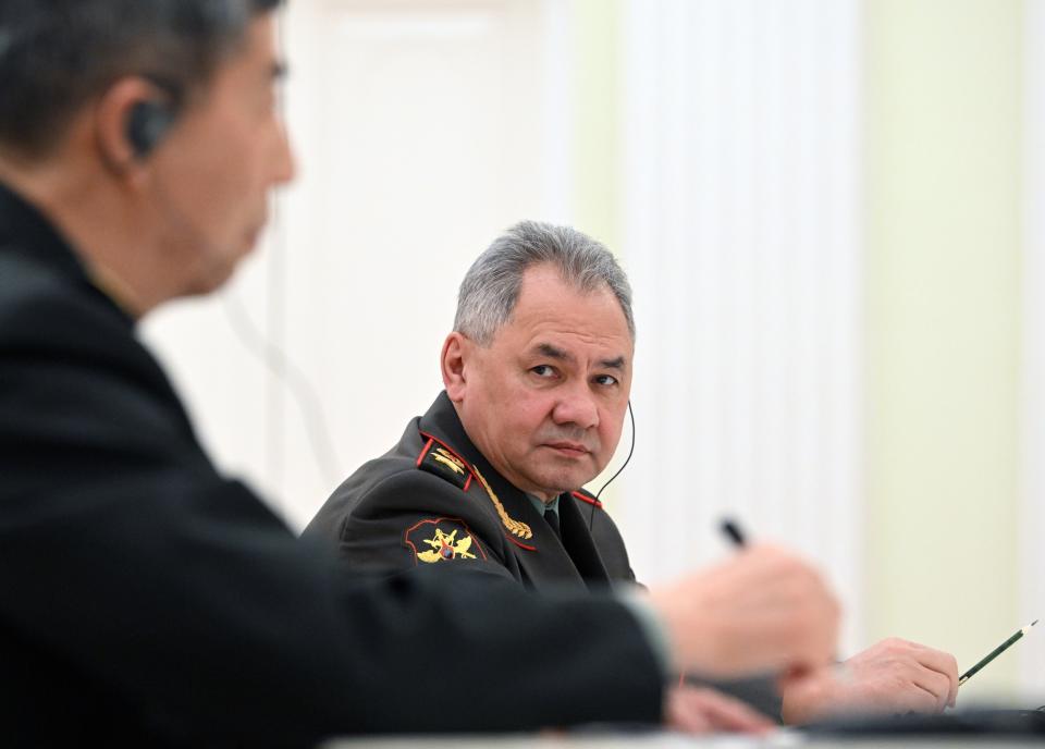 Russian Defense Minister Sergei Shoigu, center, looks at China's Defense Minister Gen. Li Shangfu, left, during their meeting with Russian President Vladimir Putin at the Kremlin in Moscow, Russia, Sunday, April 16, 2023. (Pavel Bednyakov, Sputnik, Kremlin Pool Photo via AP)