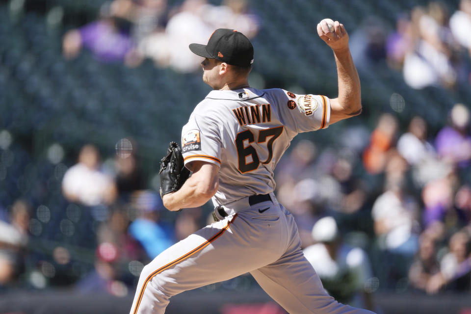 San Francisco Giants starting pitcher Keaton Winn works against the Colorado Rockies during the first inning in the first baseball game of a doubleheader, Saturday, Sept. 16, 2023. (AP Photo/David Zalubowski)