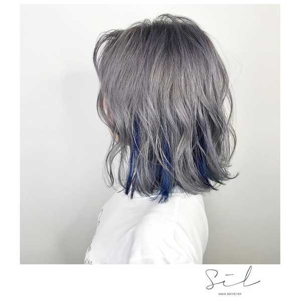 <em>Silvery with a hint of Blue by <a href="http://www.beautyundercover.sg/hair/sil-hair-artistry-bugis/" rel="nofollow noopener" target="_blank" data-ylk="slk:SIL Hair Artistry @ Bugis;elm:context_link;itc:0;sec:content-canvas" class="link ">SIL Hair Artistry @ Bugis</a></em>