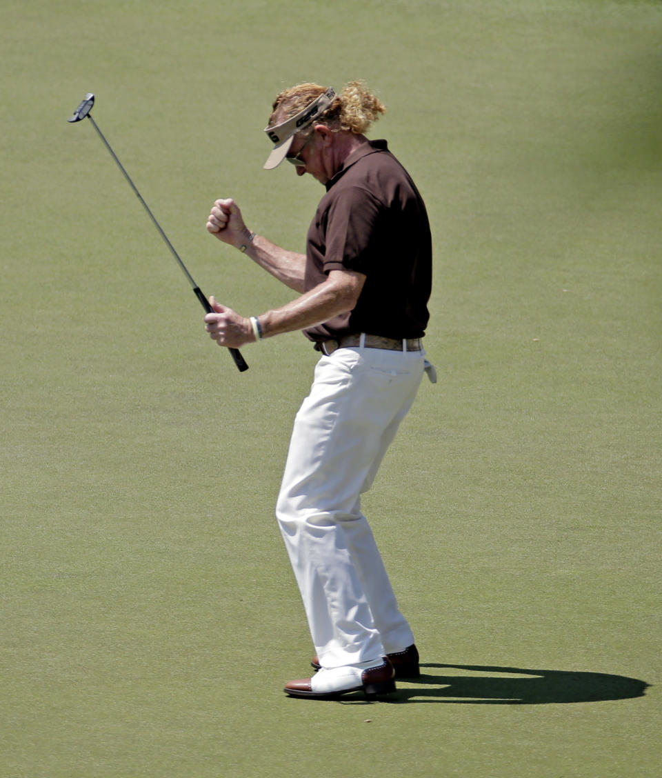 Miguel Angel Jimenez, of Spain, pumps his fist after a birdie on the 16th hole during the third round of the Masters golf tournament Saturday, April 12, 2014, in Augusta, Ga. (AP Photo/Charlie Riedel)