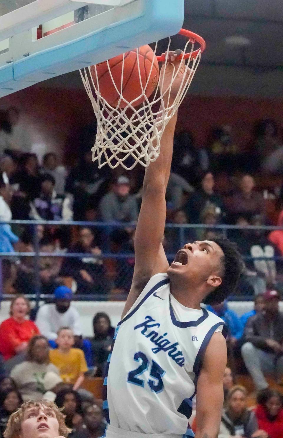 Nicolet junior Davion Hannah (25) dunks the ball during the first half of their game Tuesday, Dec. 12, 2023, against Grafton at Nicolet High School in Glendale, Wisconsin. Ebony Cox / Milwaukee Journal Sentinel