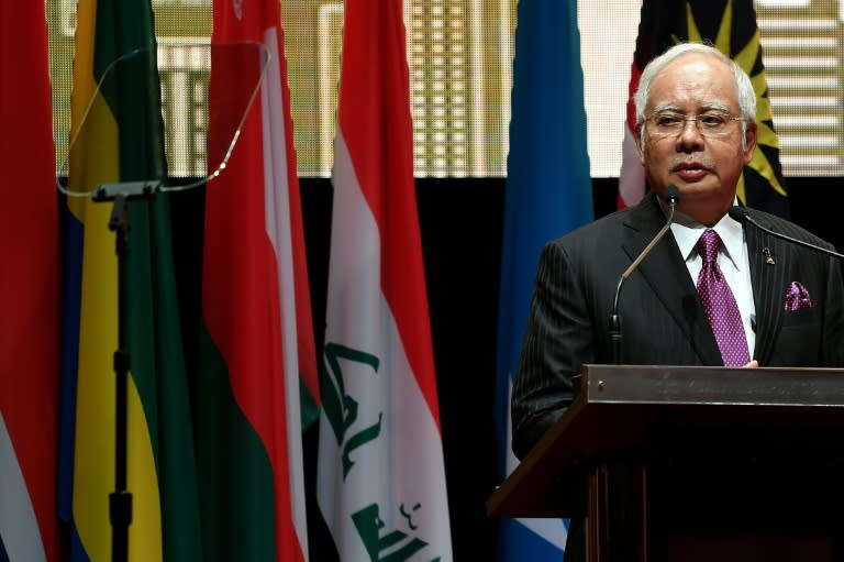 Malaysian Prime Minister Najib Razak addresses the Extraordinary Session of the Organisation of Islamic Cooperation (OIC) on the Rohingya situation in Myanmar, in Kuala Lumpur, on January 19, 2017