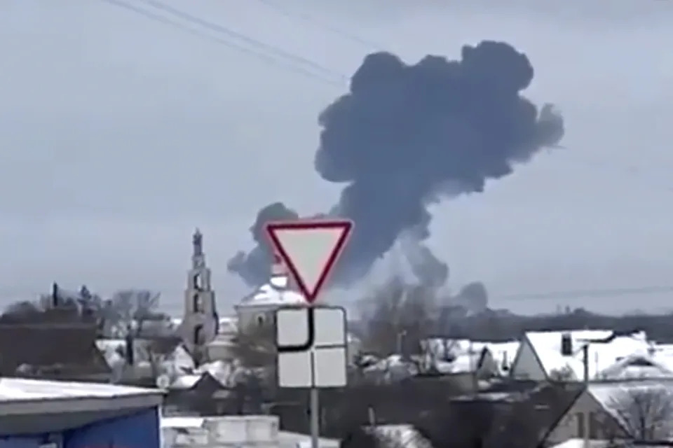 In this photo taken from validated UGC video smoke rises from the scene of a warplane crash at a residential area near Yablonovo, Belgorod region, Wednesday, Jun. 23, 2024. Russia says a military transport plane that was carrying 65 Ukrainian prisoners of war has crashed in a Russian region near Ukraine. (Validated UGC video via AP)