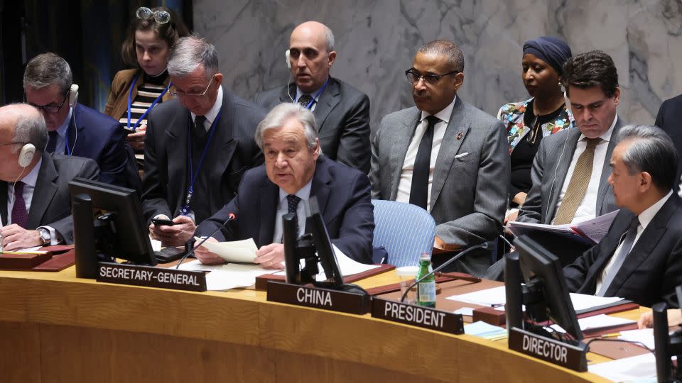 China's Foreign Minister Wang Yi and United Nations Secretary-General Antonio Guterres attend a UN Security Council meeting on the conflict between Israel and Hamas, in New York on November 29. - Brendan McDermid/Reuters